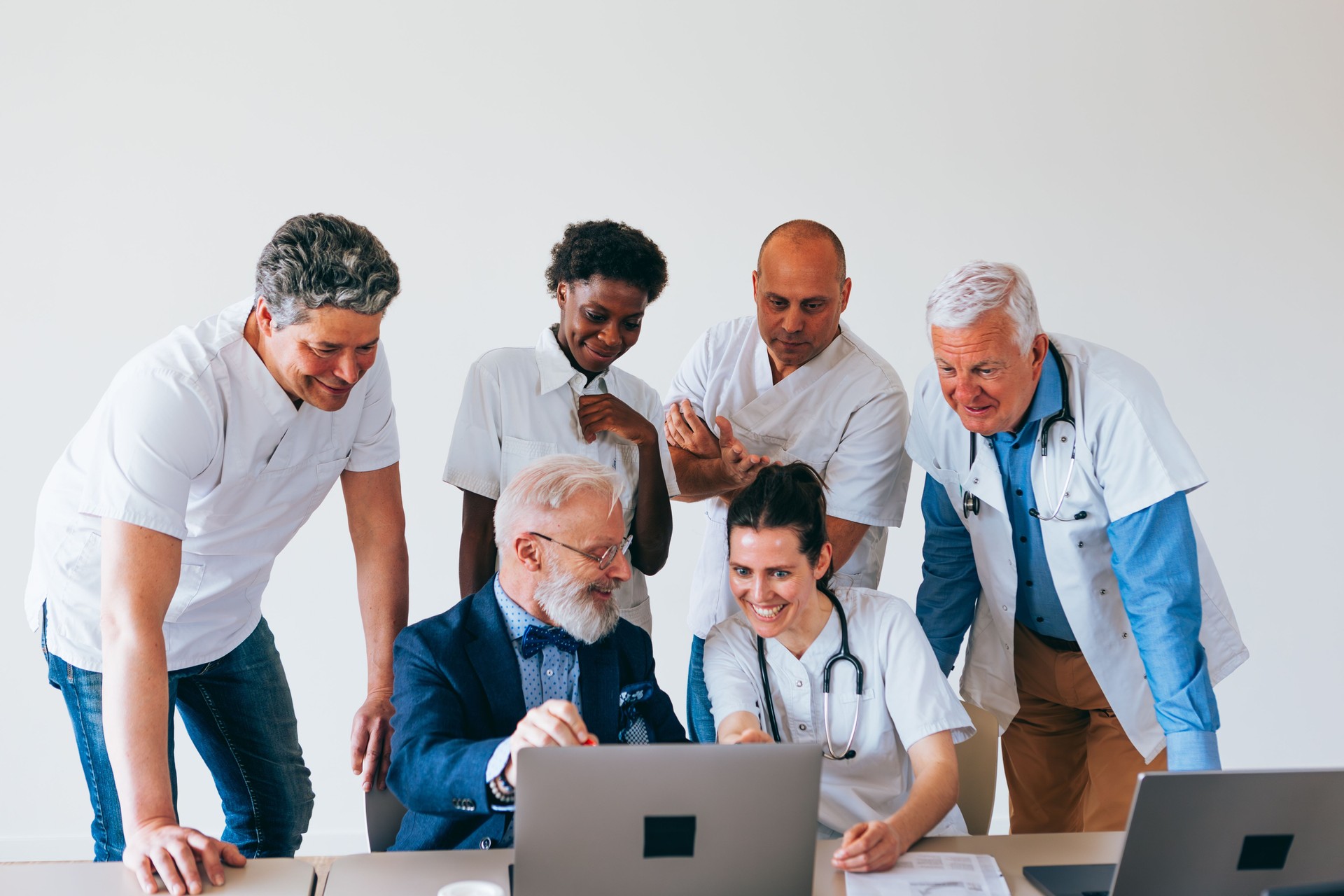 Medical team collaborating with senior professional